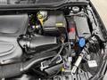 Engine compartment of a 2016 Mercedes-Benz GLA-250 showcasing various components including the air intake system battery and cooling system parts
