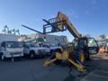 A yellow 2013 JCB 510-56 Loadall telehandler with a telescopic arm and forklift attachment positioned in the foreground