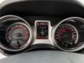 Dashboard of a 2013 Dodge Journey showing speedometer fuel gauge and information display