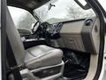 Interior of a 2009 Ford F-550 showing a driver's seat dashboard and control panel with a focus on the Super Duty branding