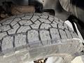 Close-up of a heavily treaded tire from a 2017 Chevrolet Express showcasing deep grooves and textured surface for traction