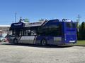 A 2018 Grande West Vicinity bus with a blue and white design and the text "CLEAN AIR VEHICLE" on the side