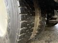 Close-up of the tire of a 2013 International Durastar 4300 showing deep tread patterns and sidewall design