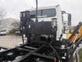 A 2016 Freightliner 108SD truck with a black chassis and equipment mounted on the back including fuel tanks and various control units