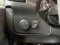 Dashboard controls of a 2019 Chevrolet Express showing the headlight switch and dome light switch