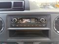 Dashboard of a 2022 Ford E-450 featuring a radio display with time and date information