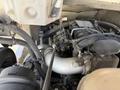 Close-up view of the engine compartment of a 2017 Freightliner MT45 showcasing various components including pipes wiring and the engine block