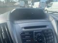 Dashboard of a 2017 Ford Transit featuring a display screen and control buttons for radio and media functions