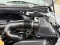 Close-up of the engine compartment of a 2018 Ford F-150 featuring the air intake system and various engine components