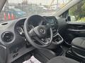 Interior view of a 2021 Mercedes-Benz Metris showing the steering wheel dashboard and center console with various controls and displays