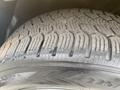 A close-up of a tire from a 2019 Dodge Charger showing detailed tread patterns and sidewall markings