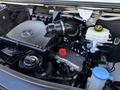 Close-up of the engine compartment of a 2023 Mercedes-Benz Sprinter 2500 showing various mechanical components and fluid reservoirs