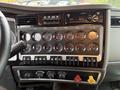 Dashboard of a 2018 Kenworth T800 featuring various gauges switches and controls including speedometer and audio system