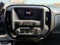 Dashboard of a 2017 Chevrolet Silverado 1500 featuring a center console display and various control buttons for audio and climate settings
