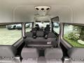 Interior view of a 2017 Mercedes-Benz Sprinter with multiple rows of seats and a spacious cabin design