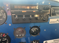 Cockpit instruments of a 1986 Sorrell Hiperbipe SNS-7 showing a Garmin radio and various gauges for altitude and voltage