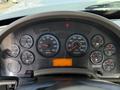 Dashboard of a 2011 International 7500 showing various dials including speedometer fuel gauge RPM and temperature readings