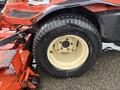 A close-up of a tire on a 2012 Kubota F3680 lawnmower showing the tread and wheel design