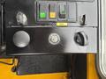 Control panel of a 2004 Bombardier SW48 featuring switches and a dial for locomotive operation