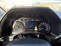 Dashboard of a 2020 Ford F-550 displaying speedometer fuel gauge and various warning lights
