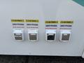 Four electrical outlets labeled with caution signs indicating 240V and 50A specifications on the side of a 2020 Freightliner MT45 vehicle