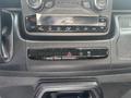 Interior control panel of a 2023 RAM Promaster 3500 featuring climate control buttons and audio system display