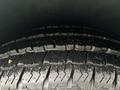 Close-up of a wet tire tread on a 2021 Mercedes-Benz Metris showing deep grooves and patterns for traction