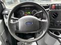 Steering wheel and dashboard of a 2017 Ford E450 featuring speedometer fuel gauge and various control buttons