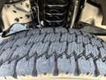 Close-up of a rugged tire on a 2017 Ford F-550 showcasing its deep treads and sturdy construction