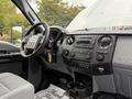 Interior view of a 2015 Ford F-350 SD showing the steering wheel dashboard and controls in a gray color scheme