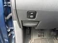 Close-up view of the dashboard of a 2006 Dodge Ram 2500 featuring a switch panel with buttons for various functions