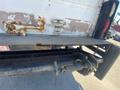 A 2014 International TerraStar truck showing rusty back doors with metal handles and a textured loading platform