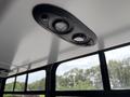 Interior ceiling lights of a 2020 Chevrolet Express featuring two round lights mounted on a black panel