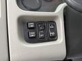 Control panel with buttons for mirror adjustment, light settings, and panel illumination in a 2014 International TerraStar