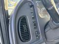 Control panel of a 2006 Freightliner M2 106 featuring buttons for various functions and an air vent on the side