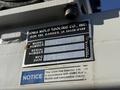 A metal identification plate from a 2009 Ford F-550 displaying model number, serial number, and manufacturing date