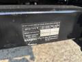 A black hitch receiver with a warning label detailing hitch type weight distribution and maximum towing capacities for a 2009 Ford F-450 Super Duty