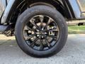 Close-up of a black wheel and tire of a 2021 Jeep Gladiator featuring a tread pattern labeled Goodyear Wrangler SR-A