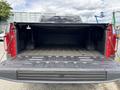 A 2019 Ford F-150 with an open tailgate showing a spacious and clean truck bed