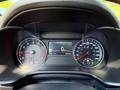 Dashboard of a 2024 Kia Forte5 showing speedometer tachometer and digital display with speed and fuel gauge