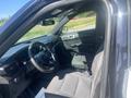 Interior view of a 2020 Ford Explorer showing the front seats dashboard and steering wheel