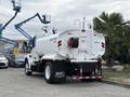 A 2025 Peterbilt 536 water truck with a large white tank at the rear featuring a hose reel and labeled with a 2000-gallon capacity
