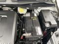 Under the hood of a 2014 RAM Cargo Van showing the battery and related components with labeled parts visible