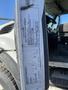 A 2014 International 7400 vehicle information sticker displayed on the door of the truck detailing specifications and manufacturing data