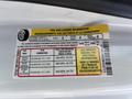 Tire and loading information sticker on a 2016 Ford Transit 150 showing seating capacity tire pressure and load values