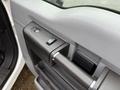 Close-up of the interior door panel of a 2016 Ford F-550 Super Duty featuring window controls and a textured armrest