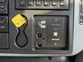 Control panel of a 2006 International 7500 featuring various switches and a Xantrax inverter with an on/off toggle and ports for connection