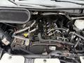 Engine of a 2017 Ford Transit showing various components including belts hoses and the alternator