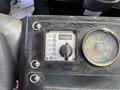 Dashboard of a 2012 International DuraStar 4300 featuring control knobs gauges and a digital display