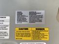 Label information for a 2016 Isuzu NPR-HD engine cooling system displaying engine specifications and cautionary notes about moving fan blades